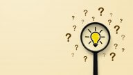 Magnifying glass with light bulb icon and question mark symbol. Concept creative idea and innovation